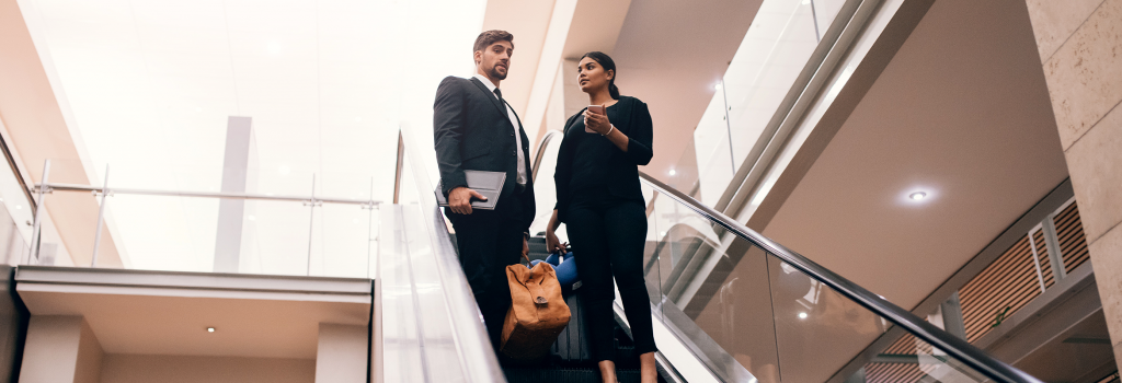 Business professionals on escalator 
