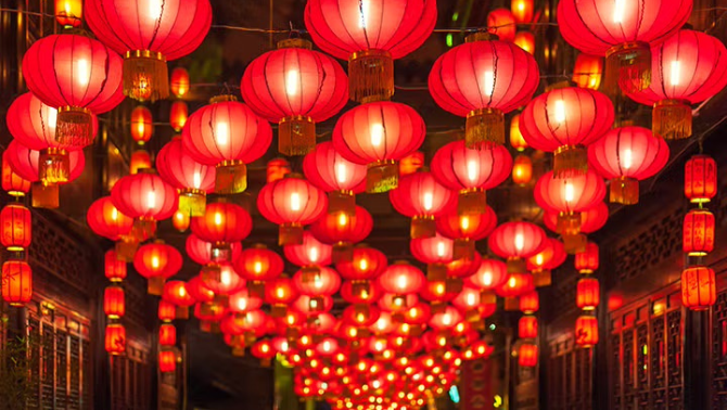 A glowing red and gold dragon lantern celebrating Lunar New Year, symbolising prosperity and reflecting traditional business customs.