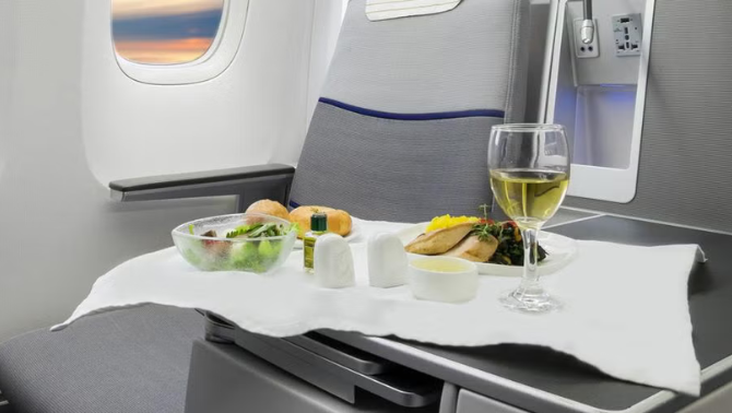 Inflight meal service showcasing Qantas Preferred Seating trial