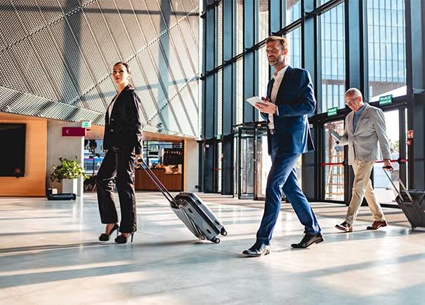 A group of people walking through the airport, symbolising the focus of Flight Centre Travel Group ahead of their Annual General Meeting.