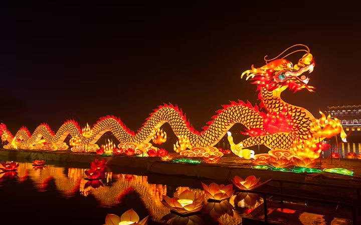 A glowing red and gold dragon lantern celebrating Lunar New Year, symbolising prosperity and reflecting traditional business customs.